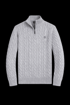 Close-up of a horse knit quarter zip sweater by Theplugcrew, showing the textured fabric and quarter-length zipper detail.
